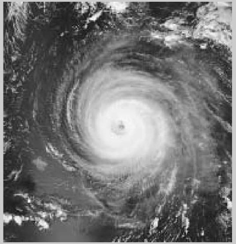A photo taken from NASA's Aqua satellite captures the counterclockwise spin of Hurricane Isabel. The hurricane's central eye, around which the hurricane circulates, is shown approximately 400 miles north of Puerto Rico (September 2003).