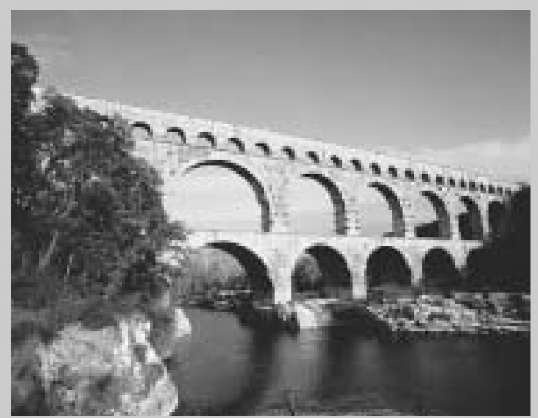Built by the ancient Romans, the three tiered Pont du Gard aqueduct spans the Gard River in France.