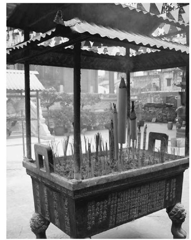 Large incense burner, Daoist temple in Guangdong, China; names of donors are listed on the side of the burner