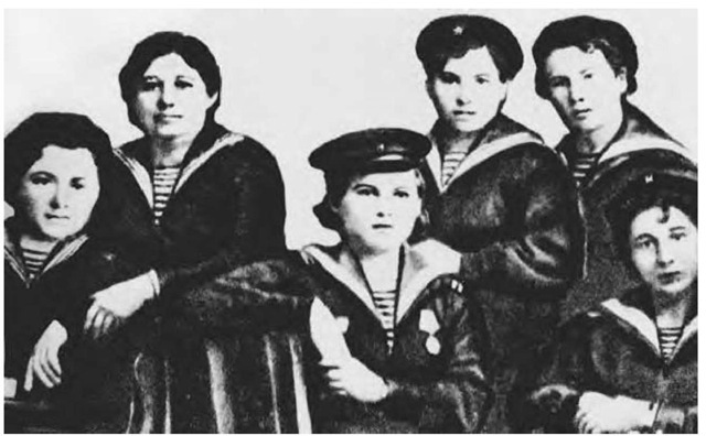 The all-female crew of Minesweeper No. 611 of the Soviet Volga Naval Flotilla. Left to right: A. F. Tarasova, E. S. Parkhacheva, A. E. Kupriianova, V. S. Chapova, T. I. Dekalina, and A. P. Shabilina. (Viktorov, S. 1986. "V ekipazhe korablia—tolko devushki" [The Ship Crew Is All-Female]. 