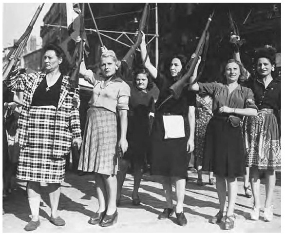 Women members of the maquis display the rifles and pistols they used to fight the Nazi garrison in Marseille before the entry of Allied troops, 1944. 