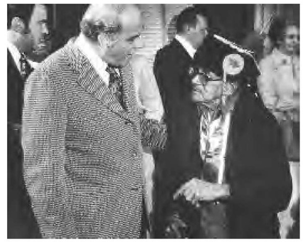 Ernest Neconish, elder statesman of the Menominee Indians of Wisconsin, chats with Senator Gaylord Nelson of Wisconsin during a Washington, D.C., ceremony, April 22, 1975, in which the tribal land of the Menominee Indians was restored to reservation status.