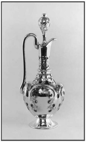 Alvin Manufacturing Company, Irvington, Moorish-style wine ewer, c. 1886-1894. Glass with silver overlay, h. 13 7/8 in. 