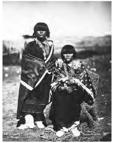 Two members of the Tesuque tribe at Tesuque Pueblo in the late nineteenth century. Today, Tesuque Pueblo contains roughly 17,000 acres. In 1993 there were 488 enrolled members of Tesuque Pueblo.