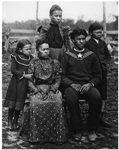 A turn-of-the-century Powhatan family from Virginia poses for a portrait in non-Indian dress. Prior to World War II, Powhatans began a community in the Philadelphia-Camden area, maintaining their native identity in part through a close network of families. They frequently intermarried with Nanticokes of Delaware and members of other tribes.