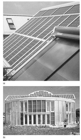 Solar house, Freiburg showing PVs and solar flat bed thermal collector with header tank. 