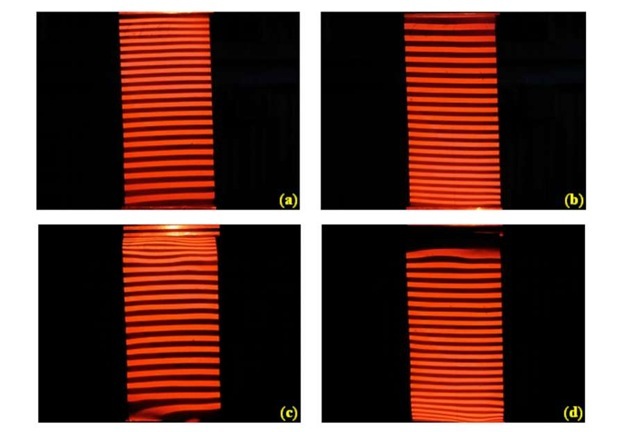 Fringes projected onto the surface of the unloaded sample (a,b) and loaded sample (c,d) by the top projector (a,c) and the bottom projector (b,d).