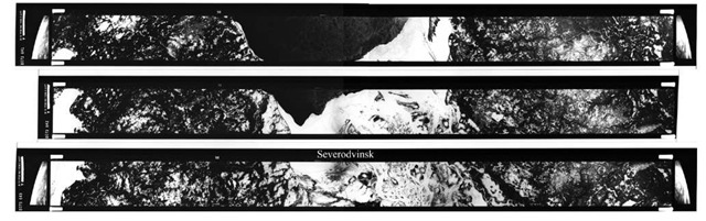 Three consecutive Corona images. The shipyard in Fig. 3.8 is in the third frame, just under the word "Severodvinsk." Note the ends of the film strips: "When the satellite's main camera snapped a picture of the ground, two small cameras took a picture of the Earth's horizon at the same time on the same piece of film. The horizon cameras helped interpreters calculate the position of the spacecraft relative to the Earth and verify the geographical area covered in the photo."