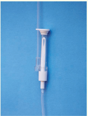 One type of inline IV filter is shown here. A filter is used with parenteral nutrition and with certain other infusions. The filter tube may be color-coded to denote the size of particles to be filtered. A special filter is also used for transfusion of blood and blood products and in some other situations.