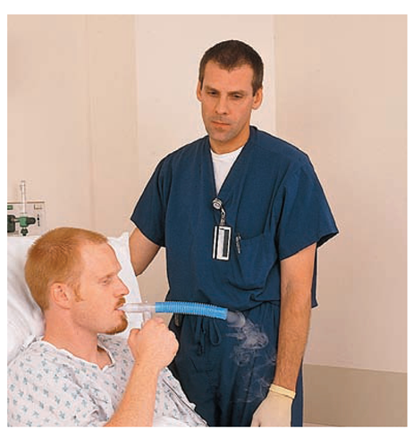 Administering a nebulizer treatment (aerosol therapy), using a flexible tube-type spacer.